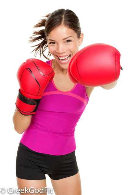 cute girl wearing boxing gloves ready to exercise